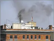  ?? JUSTIN SULLIVAN — GETTY IMAGES ?? Black smoke billows from a chimney on top of the Russian consulate on Sept. 1 in San Francisco.