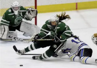  ?? JIM MICHAUD / BOSTON HERALD ?? ON TO NEXT: Canton’s Faith Nelson, center, and Norwell’s Casey Ward collide in font of Canton goaltender Carolyn Durand on Sunday. Canton beat Norwell, 3-1.