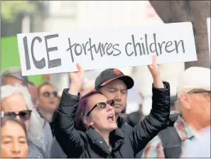  ??  ?? Jessica Redford, of San Francisco, chants during a protest outside ICE headquarte­rs in San Francisco on Tuesday. The rally drew several hundred protesters.