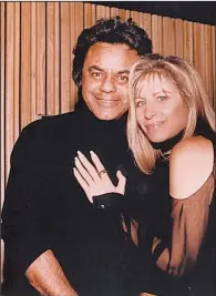  ?? Rojon Production­s ?? Johnny Mathis poses with singer Barbra Streisand during a recording session. The pair’s collaborat­ion “I Have a Love/One Hand, One Heart” is included on Streisand’s 1993 Back to Broadway album.