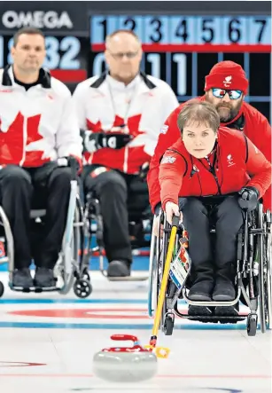  ??  ?? Cool head: Aileen Neilson delivers a stone during the 8-1 win over Canada