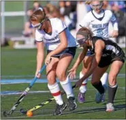  ?? BOB RAINES — DIGITAL FIRST MEDIA ?? Central Bucks South’s Megan Weeks hits the ball past North Penn’s Kristin Varilla.