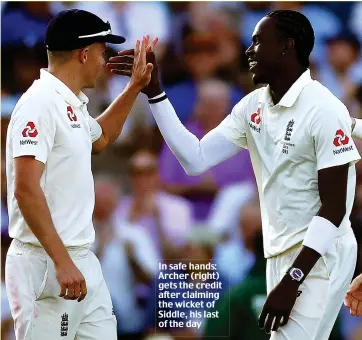  ??  ?? In safe hands: Archer (right) gets the credit after claiming the wicket of Siddle, his last of the day