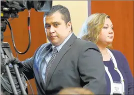  ?? PHOTOS by JOE BURBANK/ THE ASSOCIATED PRESS ?? George Zimmerman, 29, arrives in court Monday in Sanford, Fla., with his wife, Shellie. Zimmerman is on trial in the 2012 shooting death of Trayvon Martin, 17.