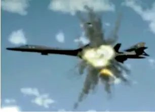  ?? AP ?? An image made on Tuesday from a propaganda video released by North Korea state-run media shows a simulation of a B-1B bomber being hit by a missile. —