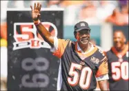  ?? Gary Landers / Associated Press ?? Former Bengals cornerback Ken Riley waves to the crowd during a halftime 50th anniversar­y ceremony in a 2017 game against the Ravens in Cincinnati.