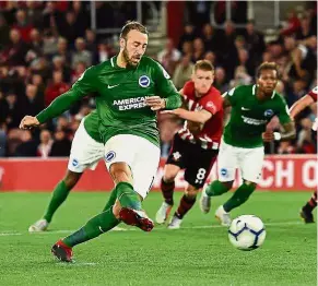  ??  ?? Right on target: Brighton striker Glenn Murray (left) scoring a penalty against Southampto­n during the English Premier League match at St Mary’s on Monday. — AFP