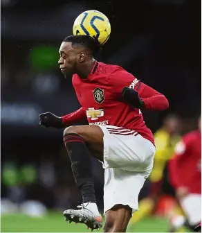  ?? — aP ?? Heads up: manchester united’s anthony martial gets hit with the ball at Vicarage road.