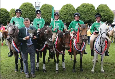  ??  ?? John Driver with the Shillelagh Pony Games team of Jack Nolan, Mollie Kinsella, Zach Furlong, Robbie Jackson and Jamie Doyle after their win in the Pony Club Games final at the RDS. photo: Dave Barrett