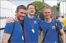  ??  ?? All smiles after finishing fourth, fifth and sixth in 2014’s 10K race are Daniel Sheldrick, right, Stuart McGeachy, left, and James Murdoch, centre.