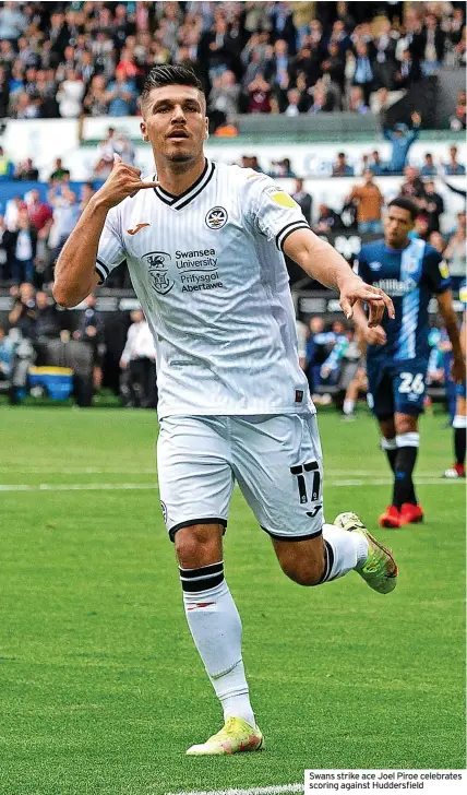  ?? ?? Swans strike ace Joel Piroe celebrates scoring against Huddersfie­ld