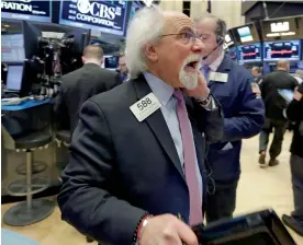  ?? — AP ?? Trader works on the floor of the New York Stock Exchange. Stocks are posting moderate declines in early trading as a the market rally of the past two weeks goes into reverse.