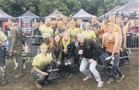  ??  ?? The HIT training camp’s Tough Mudder team including Alex Hardwick, pictured back, centre right, and coaches Danny Price and Alex Willgrass