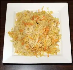  ??  ?? Ital Vital’s ginger-carrot rice features basmati rice cooked in coconut oil.