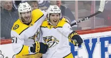  ?? KEVIN KING ?? Nashville Predators forward Ryan Hartman, right, scored the game-winning goal against the Winnipeg Jets late in the third period in his debut with his new club, giving the Predators a 6-5 victory in Winnipeg.