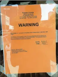  ?? Arkansas Democrat-Gazette/SCOTT CARROLL ?? The Pulaski County sheriff’s office posted an eviction notice Sept. 12 on the front door of Jerky’s Spicy Chicken and More, 521 Center St., Little Rock, possibly closing a long struggle between owner John Walker Jr. and the building owners.