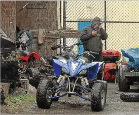  ?? FILE PHOTO ?? A Trenton Police officer looks over ATVs in a lot behind the 1100 block of East State Street in Trentonsev­eral years ago. I wish they confiscate­d the one I ended up on.