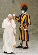  ?? ?? WATCHFUL EYES. Pope Francis walks past a Swiss Guard to the weekly general audience at Paul VI hall.