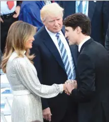  ?? The Canadian Press ?? Canadian Prime Minister Justin Trudeau shakes hands with Melania Trump as U.S. President Donald Trump looks on at the G7 Summit in Taormina, Italy, on Friday.