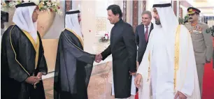  ?? Wam ?? Sheikh Mohamed bin Zayed Al Nahyan looks on as Lt-Gen Sheikh Saif bin Zayed Al Nahyan, Deputy Prime Minister and Minister of Interior, greets Imran Khan during a reception at the Presidenti­al Airport in Abu Dhabi on Wednesday. —