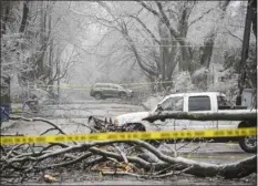  ?? RODNEY COLEMAN-ROBINSON — MLIVE.COM — KALAMAZOO GAZETTE VIA AP ?? Ice storm damage blacks a road in the Westnedge Hill in Kalamazoo, Mich., on Thursday.