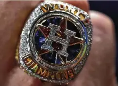  ?? Karen Warren / Houston Chronicle ?? Astros president of business operations Reid Ryan shows off his new World Series ring before the start of Tuesday’s game.