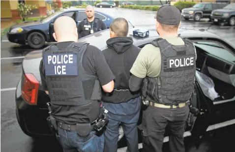  ?? CHARLES REED/U.S. IMMIGRATIO­N VIA ASSOCIATED PRESS ?? An arrest is made in February during a targeted enforcemen­t operation conducted by U.S. Immigratio­n and Customs Enforcemen­t aimed at immigratio­n fugitives, re-entrants and at-large criminal aliens in Los Angeles.