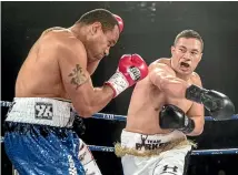  ?? PHOTO: IAIN MCGREGOR/FAIRFAX NZ ?? Joseph Parker (right) throws a right hook at Solomon Haumono during their heavyweigh­t bout at Horncastle Arena.