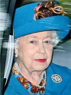  ??  ?? Royal blue: The Queen goes to church yesterday