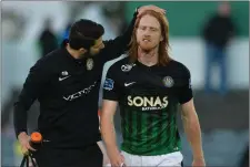  ??  ?? Hugh Douglas of Bray Wanderers leaves the field after picking an a blood injury against Dundalk.