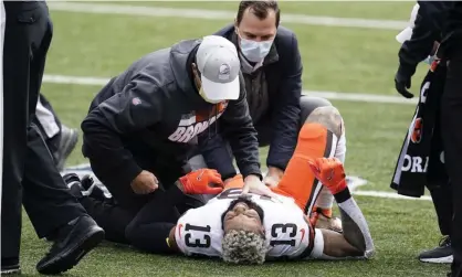  ?? Photograph: Michael Conroy/AP ?? The Browns’ Odell Beckham Jr suffered a torn left knee ligament during Sunday’s 37-34 win at Cincinnati.