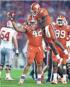  ?? MARK J. REBILAS, USA TODAY SPORTS ?? Clemson’s Christian Wilkins (42), a five-star recruit in 2015, made a key fumble recovery vs. Ohio State in the Fiesta Bowl.