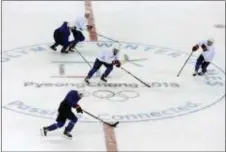  ?? KIICHIRO SATO — THE ASSOCIATED PRESS ?? Members of the United States men’s hockey team practice in Gangneung, South Korea on Friday.