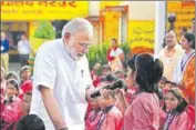  ?? HT ?? PM Narendra Modi interacts with students at a government­run primary school in Varanasi, on his birthday on Monday