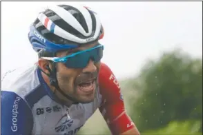  ?? The Associated Press ?? MOVING IN: France’s Thibaut Pinot climbs Prat d’Albis Sunday during the fifteenth stage of the Tour de France, over 185 kilometers (114,95 miles) with start in Limoux and finish in Prat d’Albis, France.