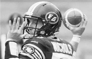  ?? Graham Hughes/ THE CANAD IAN PRESS ?? Edmonton Eskimos backup quarterbac­k Matt Nichols throws a pass against the Alouettes during fourth-quarter CFL action in Montreal on Sunday.
