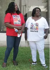  ?? Staff photo by Greg Bischof ?? ■ Carolyn Beal, the mother of Eric Wilson, and Rosalind Witcher, the mother of Demonstrou­s Witcher, stand at a rally Saturday outside the Bi-State Justice Building.