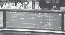  ?? Photo by Anwar Daifallah ?? Photo shows a segment of ticker board at KSE trading floor. The bourse
extended gains on Thursday.