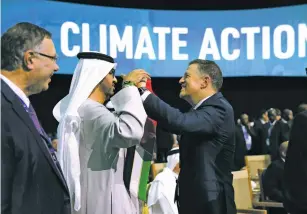  ?? HOLLIE ADAMS/BLOOMBERG NEWS ?? Sultan al-Jaber, CEO of Abu Dhabi National Oil Co. and president of COP28, center, with Majid Jafar, CEO of Crescent Petroleum Co., on Saturday at COP28 in Dubai, United Arab Emirates.