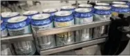  ?? DIGITAL FIRST MEDIA FILE PHOTO ?? In this file photo, filled cans of the new SRT Ale move along the canning line for packaging at Sly Fox Brewery on Circle of Progress Drive in Pottstown.
