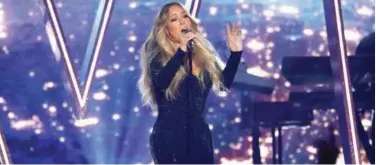  ?? File / Reuters ?? ↑
Mariah Carey performs during an award show in Las Vegas, Nevada.
