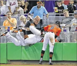  ?? WILFREDO LEE / ASSOCIATED PRESS ?? Marlins second baseman Dee Gordon (9), first baseman Justin Bour (center) and right fielder Giancarlo Stanton dive for Matt Harvey’s foul ball.