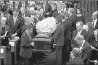  ?? JOYCE MARSHALL/THE ASSOCIATED PRESS ?? Pall bearers carry the casket of Van Cliburn into Broadway Baptist Church in Fort Worth, Texas, on Sunday.