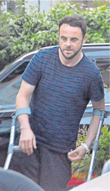  ??  ?? Ant Mcpartlin walks with the aid of crutches. The TV presenter has admitted he was addicted to prescripti­on drugs and alcohol