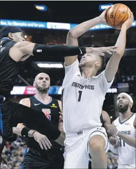  ?? Brandon Dill Associated Press ?? MEMPHIS FORWARD Kyle Anderson goes to the basket against the Clippers’ Tobias Harris in the second half. The Grizzlies dominated the start and finish.