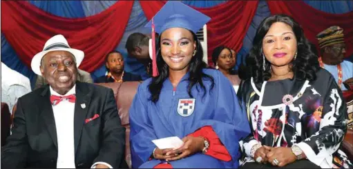  ??  ?? The best graduating medical student of Afe Babalola University Ado Ekiti (ABUAD), Miss Esther Adaobi Azom flanked by the Founder and Chancellor of the institutio­n , Chief Afe Babalola and his wife Yeye Are , Modupe, during the induction ceremony of the pioneer medical doctors of Afe Babalola University Ado Ekiti, held… recently