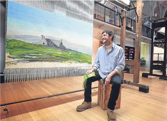  ?? Picture: PA. ?? Apprentice weaver Ben Hymers with his tapestry created from a watercolou­r painted by the Duke of Rothesay. The tapestry will be on display at the Dovecot Tapestry Studio in Edinburgh before finding its permanent home at Dumfries House in 2018.