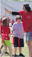  ??  ?? Luke Willson, an NFL player originally from LaSalle, says “it’s a pretty special thing” helping children get active and participat­e in sports.