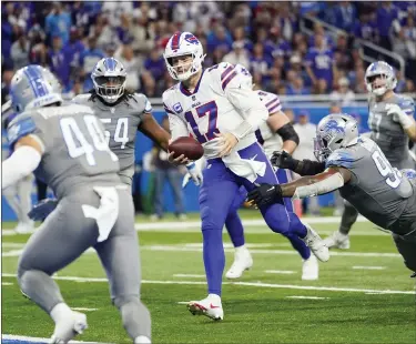  ?? PAUL SANCYA — THE ASSOCIATED PRESS ?? Buffalo Bills quarterbac­k Josh Allen runs into the end zone for a 3-yard touchdown during the first half against the Detroit Lions on Thursday.