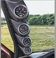  ??  ?? Four GS series Auto Meter analog gauges allow Ken to keep tabs on fuel pressure, transmissi­on temp, boost, and EGT. So far, his well-spec’d combinatio­n of parts has resulted in a constant 65-psi being delivered to the injectors at all times, boost from the S471 maxing out at 41 psi, and EGT peaking at 1,200 degrees with a load in tow.